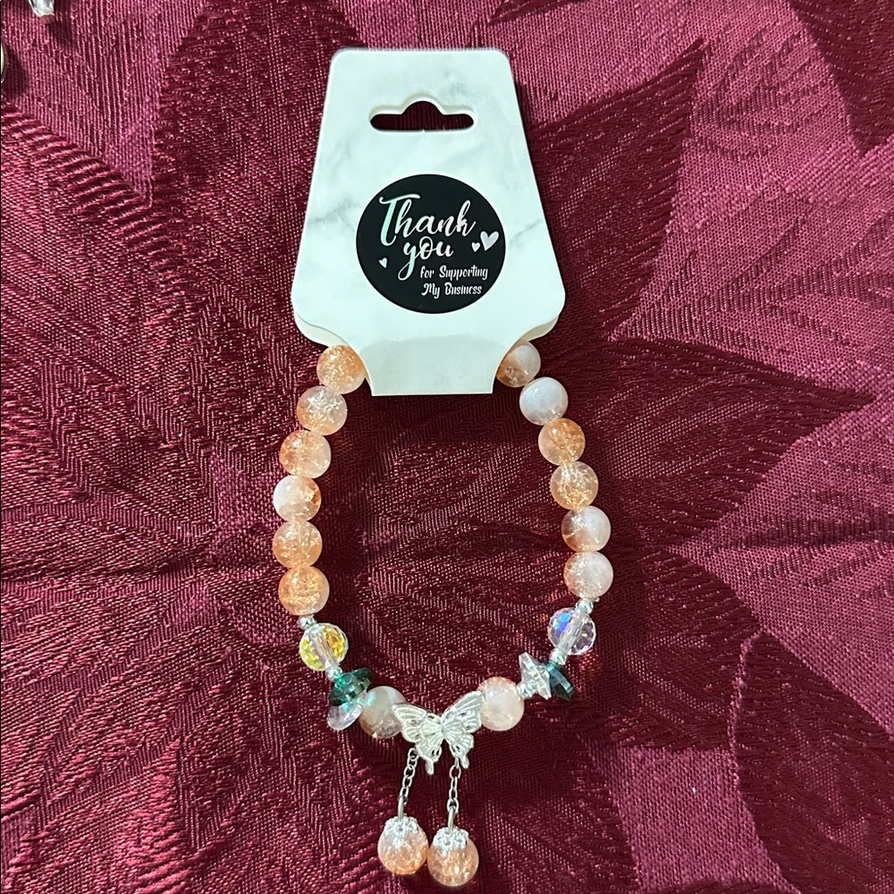 Sweet Clear/Tangerine Glass Bead Bracelet Featuring a Whimsical Butterfly Charm - Picture 4 of 4